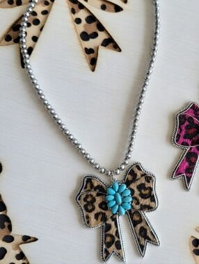 Leopard Bow Pendant Necklace with Turquoise Like Flower Accent